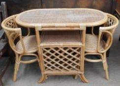 A bamboo conservatory table and two chairs