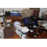 A book shaped biscuit tin together with copper lustre jugs, other jugs,