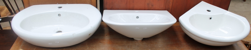 A Bellavista ceramic bathroom sink together with two other bathroom sinks
