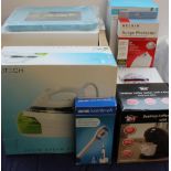 A collection of new and used boxed appliances including a multi-functional steam mop together with