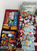 A collection of Dinky, Matchbox and other toy vehicles together with Rupert the Bear annuals,