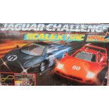 A Scalextric Jaguar Challenge set together with an Ensign Silent Sixteen Cine camera, books,