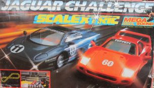 A Scalextric Jaguar Challenge set together with an Ensign Silent Sixteen Cine camera, books,