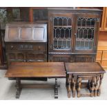 A Jaycee Furniture oak bookcase together with an oak bureau,