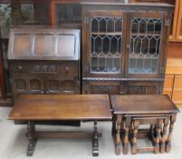 A Jaycee Furniture oak bookcase together with an oak bureau,