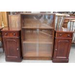 A 20th century oak bookcase together with a pair of Victorian pot cupboards