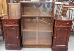 A 20th century oak bookcase together with a pair of Victorian pot cupboards