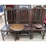 A pair of 17th century style oak dining chairs together with another oak dining chair and a chess