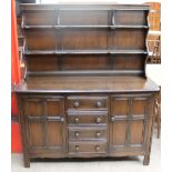 A 20th century oak Dutch Dresser with shelves to the top and drawers and cupboards to the base