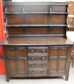 A 20th century oak Dutch Dresser with shelves to the top and drawers and cupboards to the base