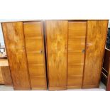 A 20th century Austinsuite walnut bedroom suite comprising two wardrobes, double bed,