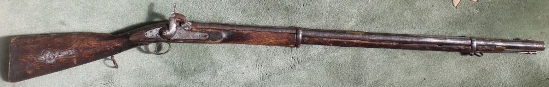 A 19th century Percussion cap rifle with a tapering barrel and ram rod