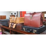 A briefcase together with suitcases etc