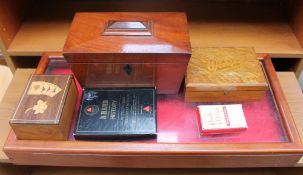 A Victorian mahogany sarcophagus shaped tea caddy together with a table top cabinet,