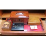 A Victorian mahogany sarcophagus shaped tea caddy together with a table top cabinet,