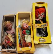 A deluxe Pelham puppet of a clown together with two other Pelham puppets