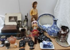 A plaster figure of a boy together with blue and white pottery, Ewenny pottery masks,