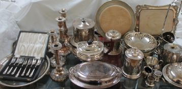 Assorted electroplated wares including candlesticks, entree dishes and covers,