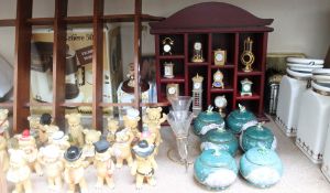 A large lot including a collection of pottery teddy bears, miniature clock collection, storage jars,