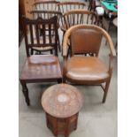 An oak elbow chair together with a set of four stick back dining chairs,