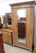 An Edwardian oak wardrobe with matching dressing table