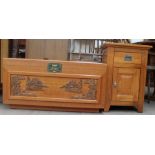 A 20th century Chinese carved coffer together with a pine bedside cabinet