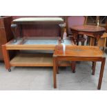 An early 20th century walnut occasional table together with a coffee table with brass corners,