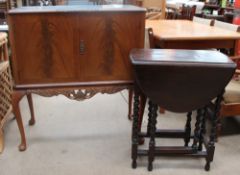 A 20th century walnut cocktail cabinet together with a small oak drop leaf table