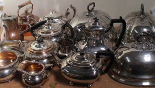 A collection of electroplated wares including dish covers, part tea service,
