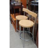A piano stool together with a teak television table, pair of bar stools, decanters, steins,