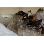 A collection of copper lustre jugs punch bowls and glasses