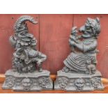 A pair of cast iron door stops in the form of Punch and Judy
