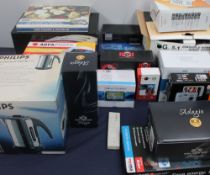 A collection of new and used boxed appliances including an home theatre system together with a