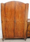 An early 20th century walnut wardrobe and matching tallboy