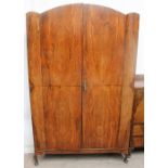 An early 20th century walnut wardrobe and matching tallboy