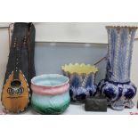 A Carlo Ricardo mandolin together with a pottery jardiniere and stand,