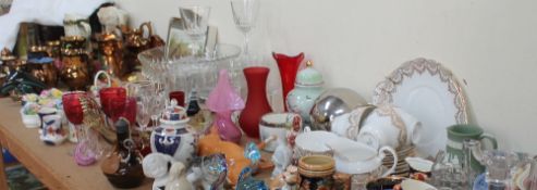 A collection of copper lustre jugs, other jugs, carnival glass dish and floral clusters,