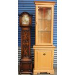 A 20th century oak grandmother clock together with a modern corner cupboard