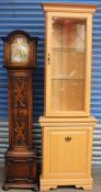 A 20th century oak grandmother clock together with a modern corner cupboard