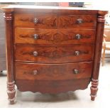 A Victorian mahogany chest of drawers with octagonal pillars and a shaped apron base
