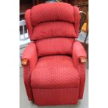 An upholstered electric reclining chair