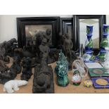 A collection of Heredities bronzed figures together with Mdina glass paperweights,