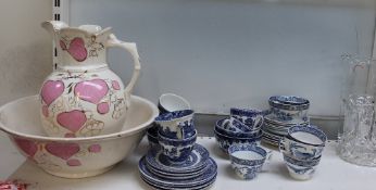 A pottery water jug and basin together with a blue and white part tea set