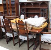 A 20th century oak 'Old Charm' dining suite comprising a wall unit,