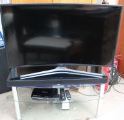 A Samsung 48" curved screen television together with a Canton sound bar,
