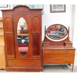 An Edwardian mahogany three-piece bedroom suite comprising a wardrobe,