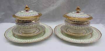 A pair of 19th century porcelain sauce tureens, covers, stands and matching plates,