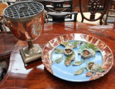 A continental Majolica horse chestnut decorated charger and a samovar base