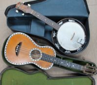 A "de Vekey" Ukulele style 3 inlaid with mother of pearl in a case,