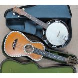 A "de Vekey" Ukulele style 3 inlaid with mother of pearl in a case,